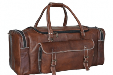 Classic brown leather travel bag with buckle closure pockets and spacious interior