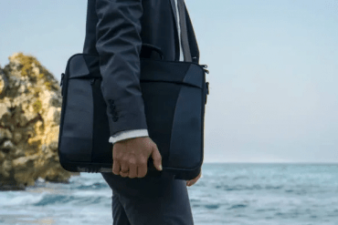 waiting-businessman-with-handbag-on-the-beach